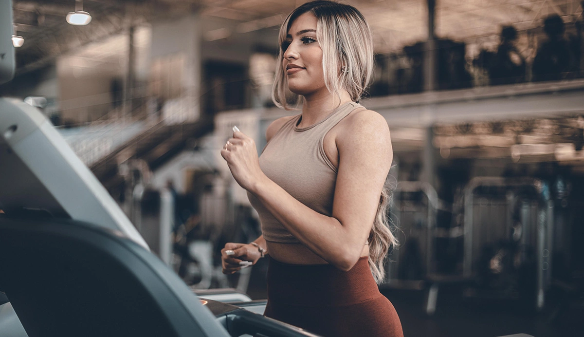 woman running on a treadmill.