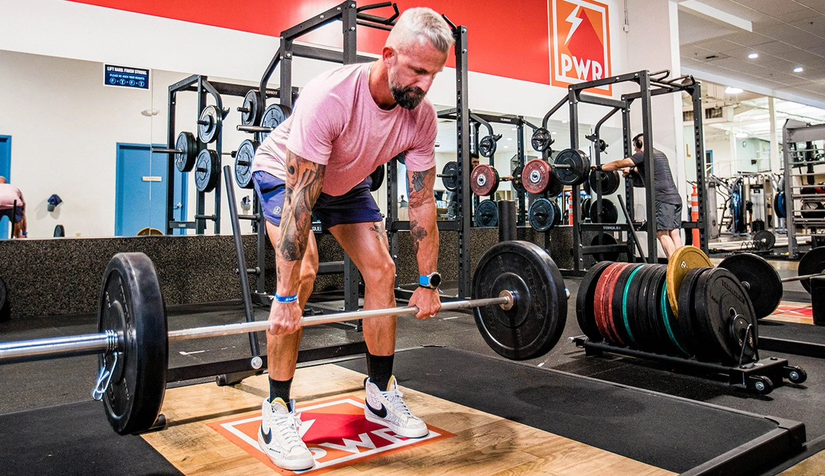 Man deadlifting a barbell