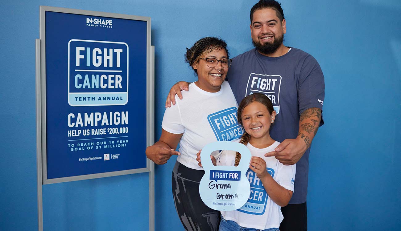 Family Holding Fight Cancer Donation Sign