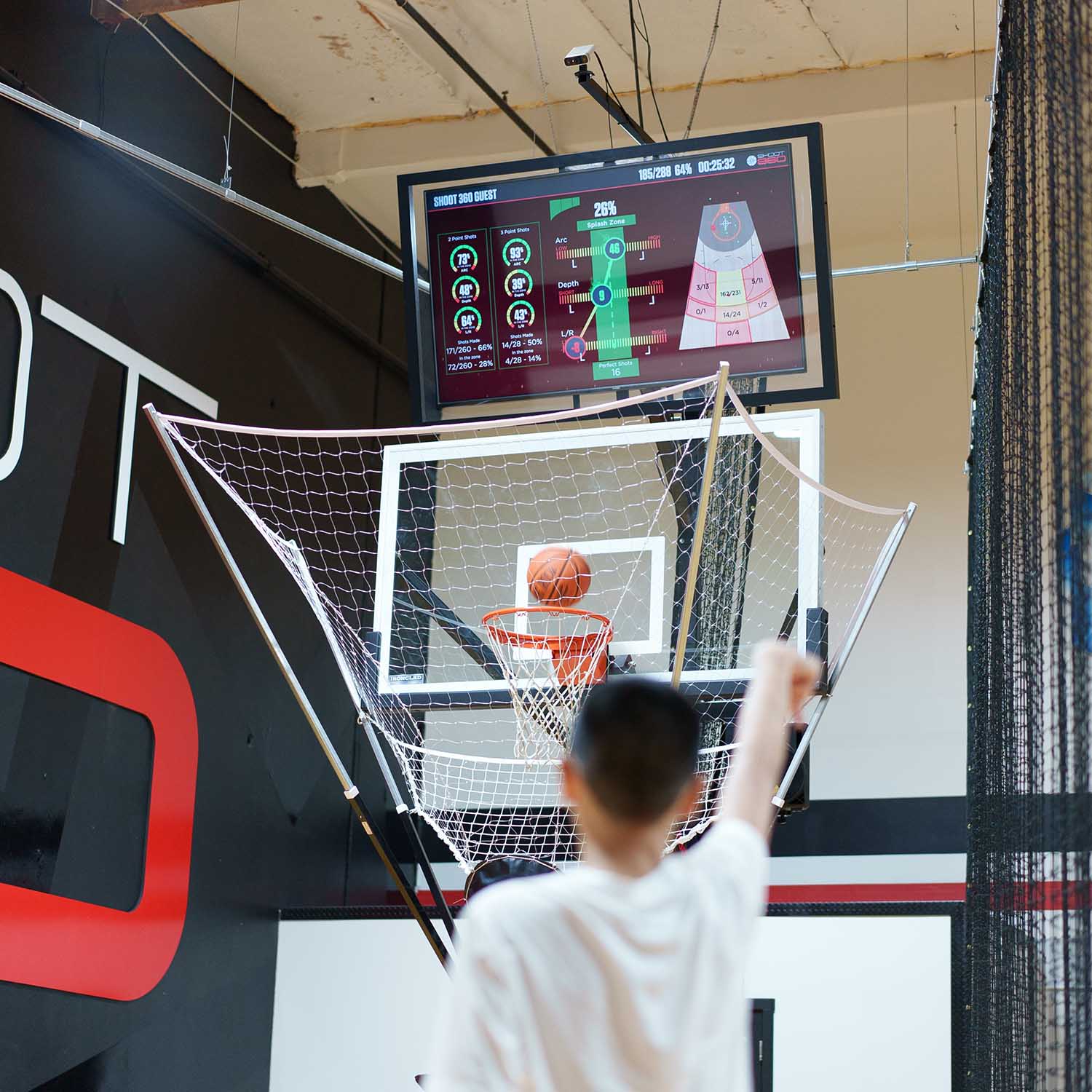 Teen shooting into Shoot360 training hoop